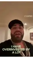 a man with a beard is wearing a hat and chains and says i have overinvested by a lot