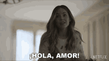 a woman says hola amor in a netflix advertisement