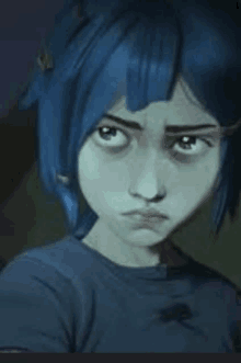 a girl with blue hair and a blue shirt is looking at the camera with a sad look on her face .