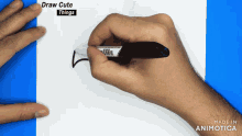 a hand is holding a marker and the words draw cute things are on the screen