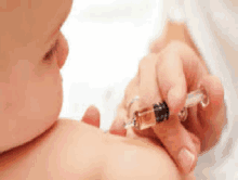 a baby is getting a vaccine from a doctor .