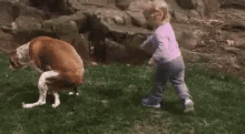 a little girl is petting a dog in a field with the words `` bon chien '' written above it .