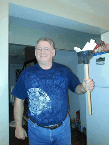 a man in a blue shirt holds a plunger