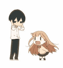 a boy and a girl are standing next to each other and talking .