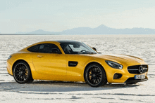 a yellow sports car with the license plate s & gt 110