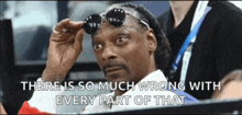 snoop dogg is wearing sunglasses and a caption that says " there is so much wrong with every part of that "