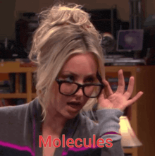 a woman wearing glasses says molecules in red