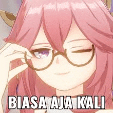 a girl with pink hair and glasses is wearing glasses and making a face .