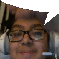 a man wearing glasses and headphones has a speech bubble above his head .