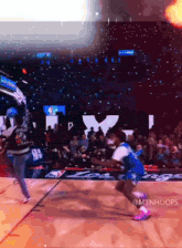 a basketball game is being played in front of a crowd with the hashtag @mtnhoops