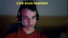 a man wearing headphones with the words " live enzo reaction " behind him