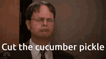 a man in a suit and tie is saying cut the cucumber pickle ..