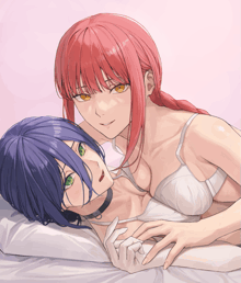 a woman with red hair is laying on another woman 's lap