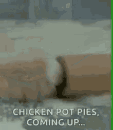 a chicken pot pie is being made in a machine and coming up .