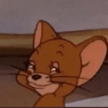 jerry from tom and jerry is looking at the camera with a sad look on his face .