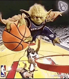 yoda is holding a basketball in his hands while playing basketball .