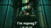 a person is sitting in a dark room with the words `` i 'm mpreg '' written on the bottom .