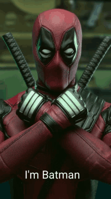 a picture of deadpool with the words " i 'm batman " on the bottom