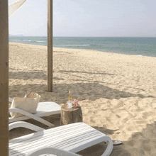 a beach with chairs and a bag on the sand