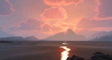 a sunset over a lake with a mountain in the background