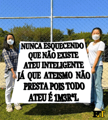 two women holding a sign that says nunca esquecendo que nao existe ateu inteligente ja que ateismo nao presta pois todo