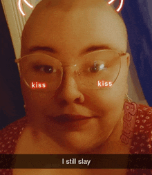 a woman with glasses and a barbie earring says kiss