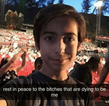 a young boy is taking a selfie in front of a crowd with the caption rest in peace to the bitches that are dying to be