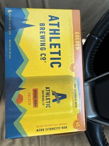 a box of athletic brewing co 's golden ale