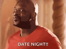 a man in a red shirt is saying `` date night '' .