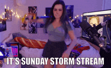 a woman dancing in front of a microphone with the words " it 's sunday storm stream "