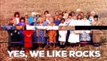 a group of women standing in a field with the words " yes we like rocks " on the bottom