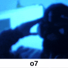 a blurred image of a person with the number 07 below it