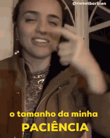 a woman in a brown jacket says o tamanho da minha patiencia