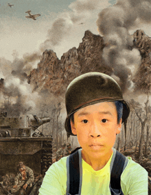 a young boy wearing a helmet is standing in front of a painting of soldiers