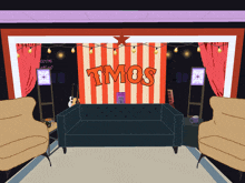 a room with a couch and chairs and a striped wall that says tmos on it