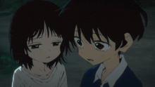 a boy and a girl are looking at each other