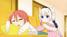 a girl with horns is standing next to another girl who is sleeping on a couch with the words ohayo written on the bottom