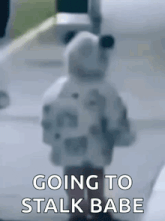 a blurred image of a stuffed animal with the words `` going to stalk babe '' written on it .