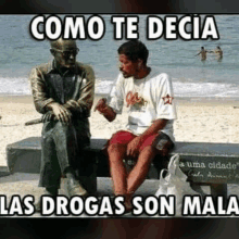 a man sitting on a bench next to a statue with the words " como te decia las drogas son mala "