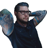 a man with glasses and a tattoo on his arm that says rs