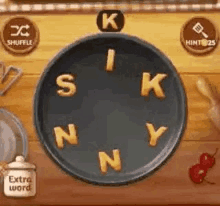 a pan with the letters s k n y and n in it