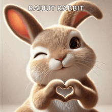 a rabbit making a heart shape with its paws and the words rabbit rabbit below it