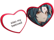 a red heart shaped mirror with a picture of xiao on it