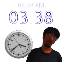 a man stands in front of a clock that reads 3:38
