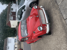 a red car with the license plate ht 1040