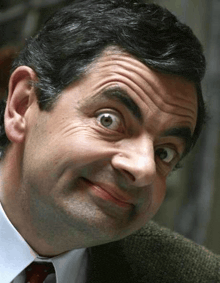 a close up of a man making a funny face