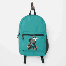 a backpack is hanging on a hook with a drawing of a man and woman on it