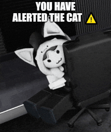 a picture of a cat sitting in front of a computer with the words " you have alerted the cat "