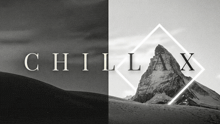 a black and white photo of a mountain with the words chillax on the bottom