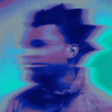 a blurry picture of a man 's face with a blue and pink background .